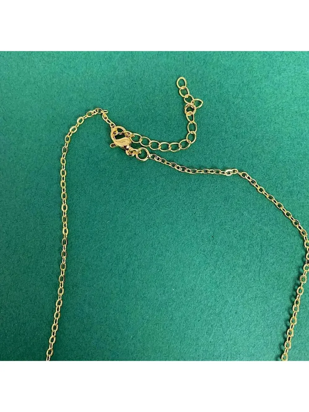 Y2k style gold Saint Marry green rhinestone pendant necklace. 19 inches length.